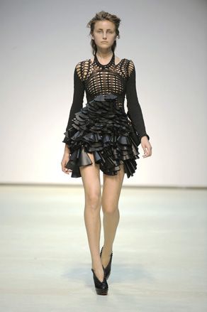 Model in black mini dress