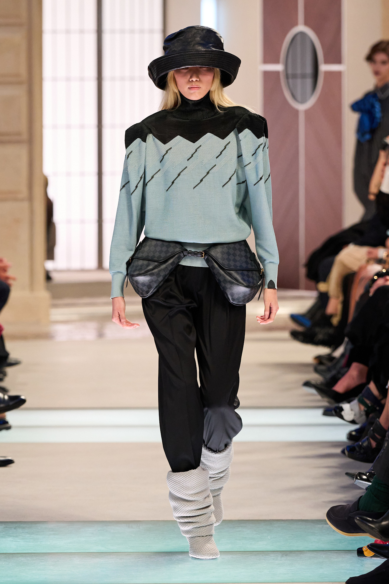 An image of slouchy boots on the Louis Vuitton autumn/winter 2025 runway.
