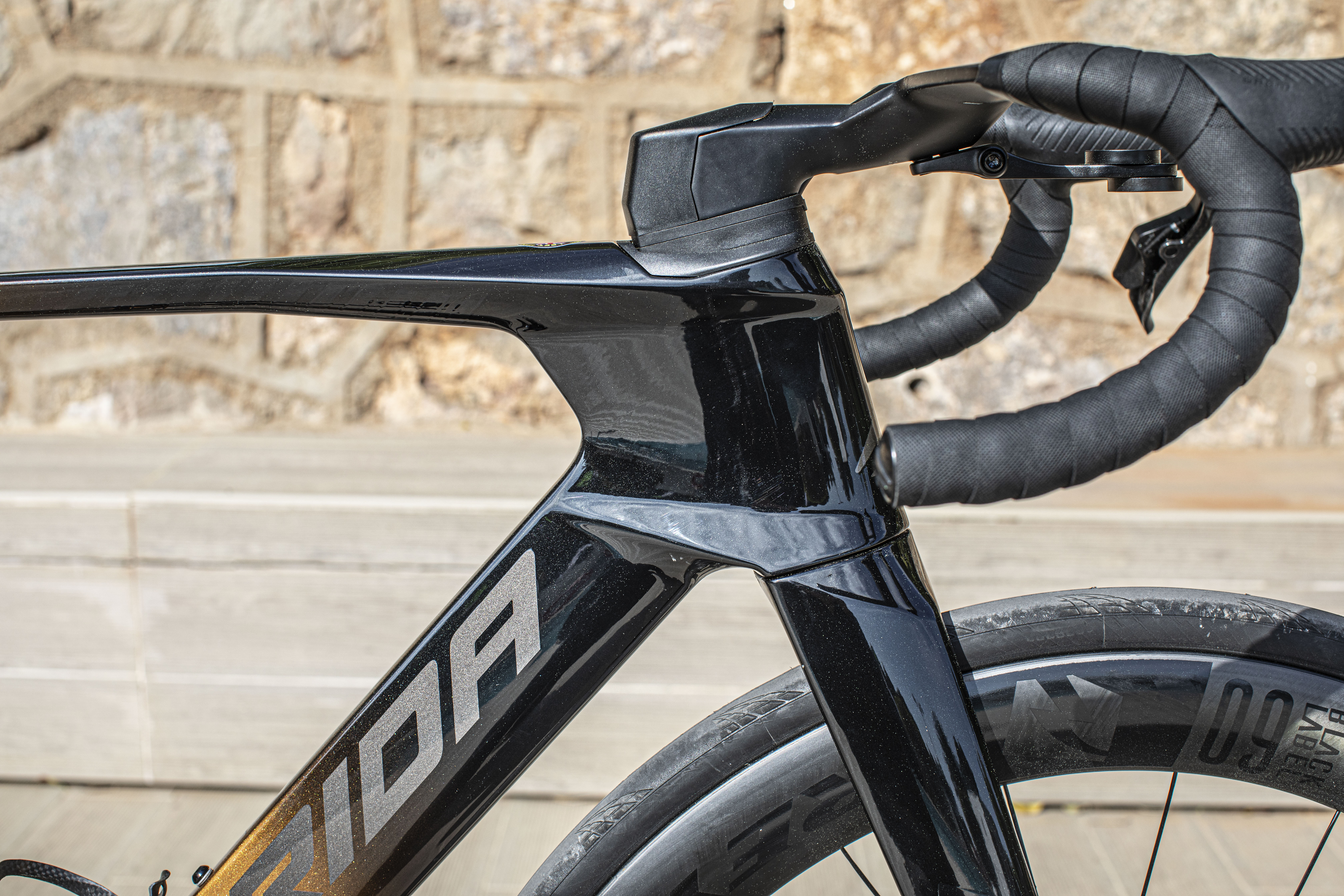 Fifth-generation Merida Reacto pictured outside with stone wall background