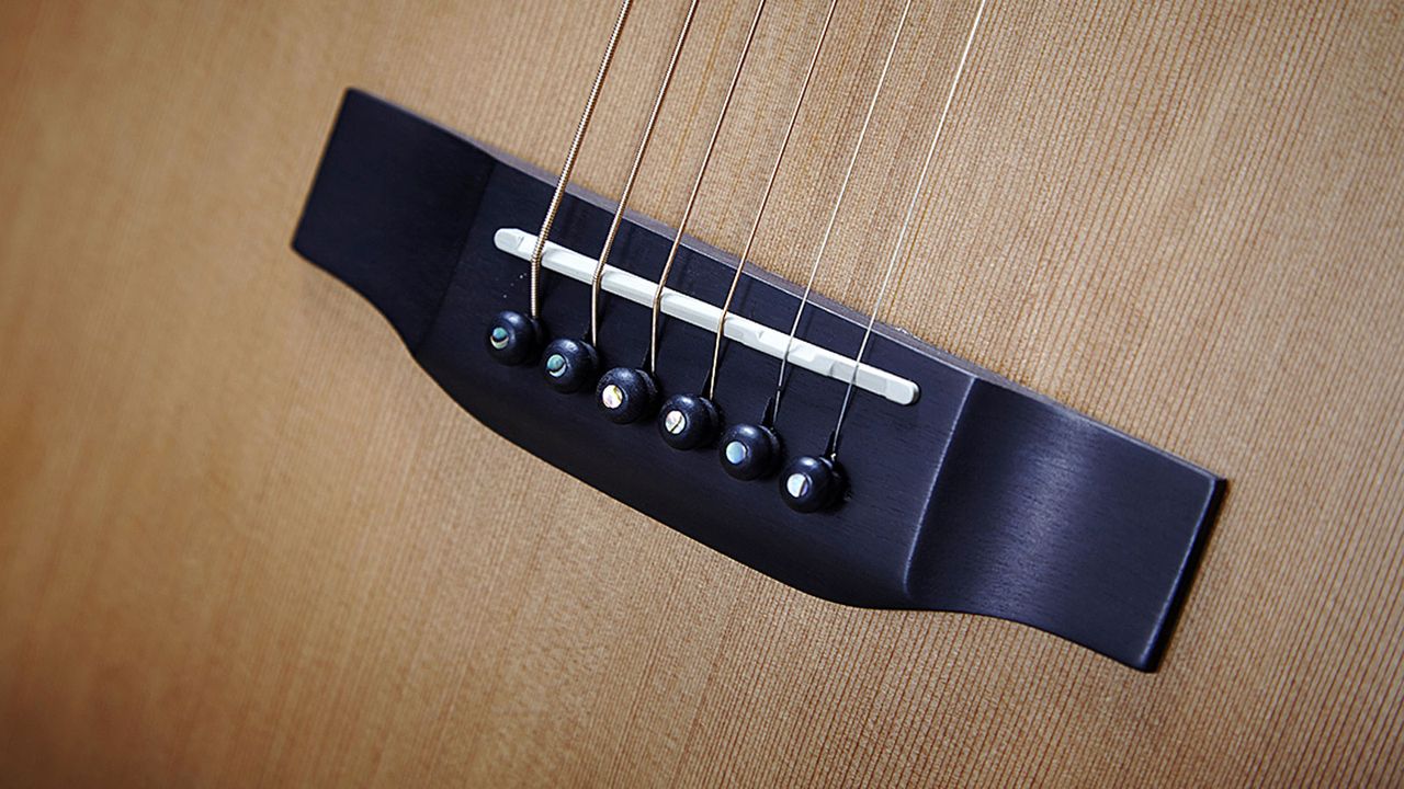 String spacing is 53mm, though you can custom spec a wider spacing if desired