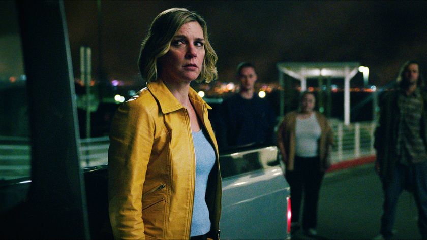 Carol looking worried as she stands next to a truck surrounded by people in Pluribus episode 1