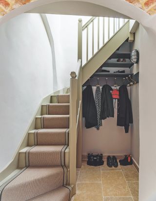 small boot room storage under stairs