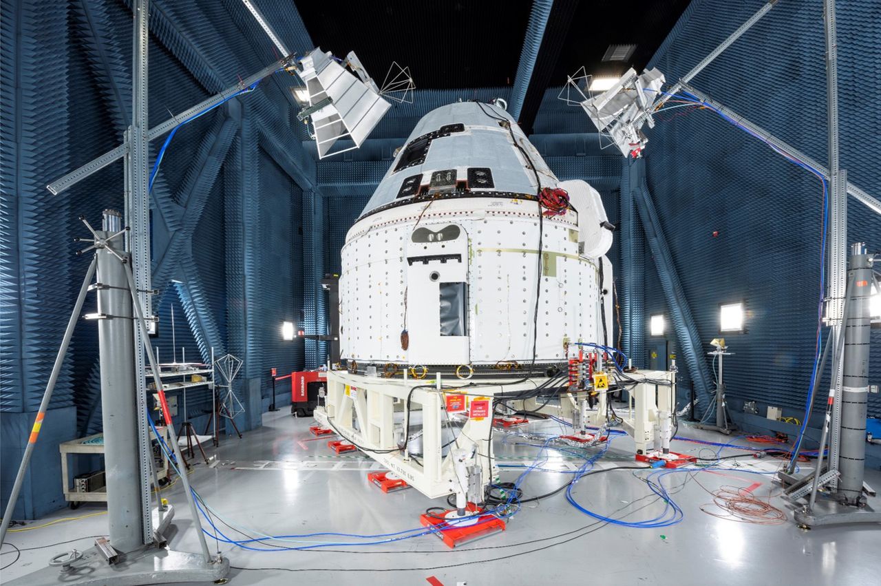 A Boeing Starliner spacecraft is prepared for a planned December 2019 test flight to the International Space Station for NASA.