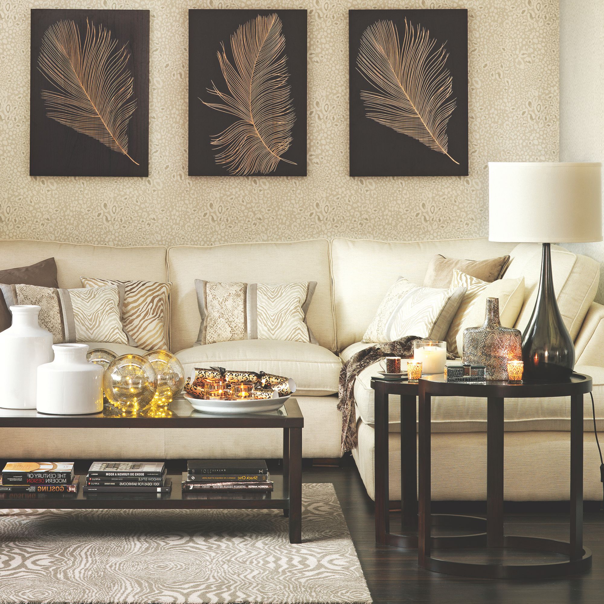 A gold and black living room with decorative cushions
