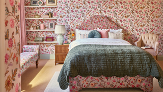 Room with floral wallpaper and matching bedframe and bench