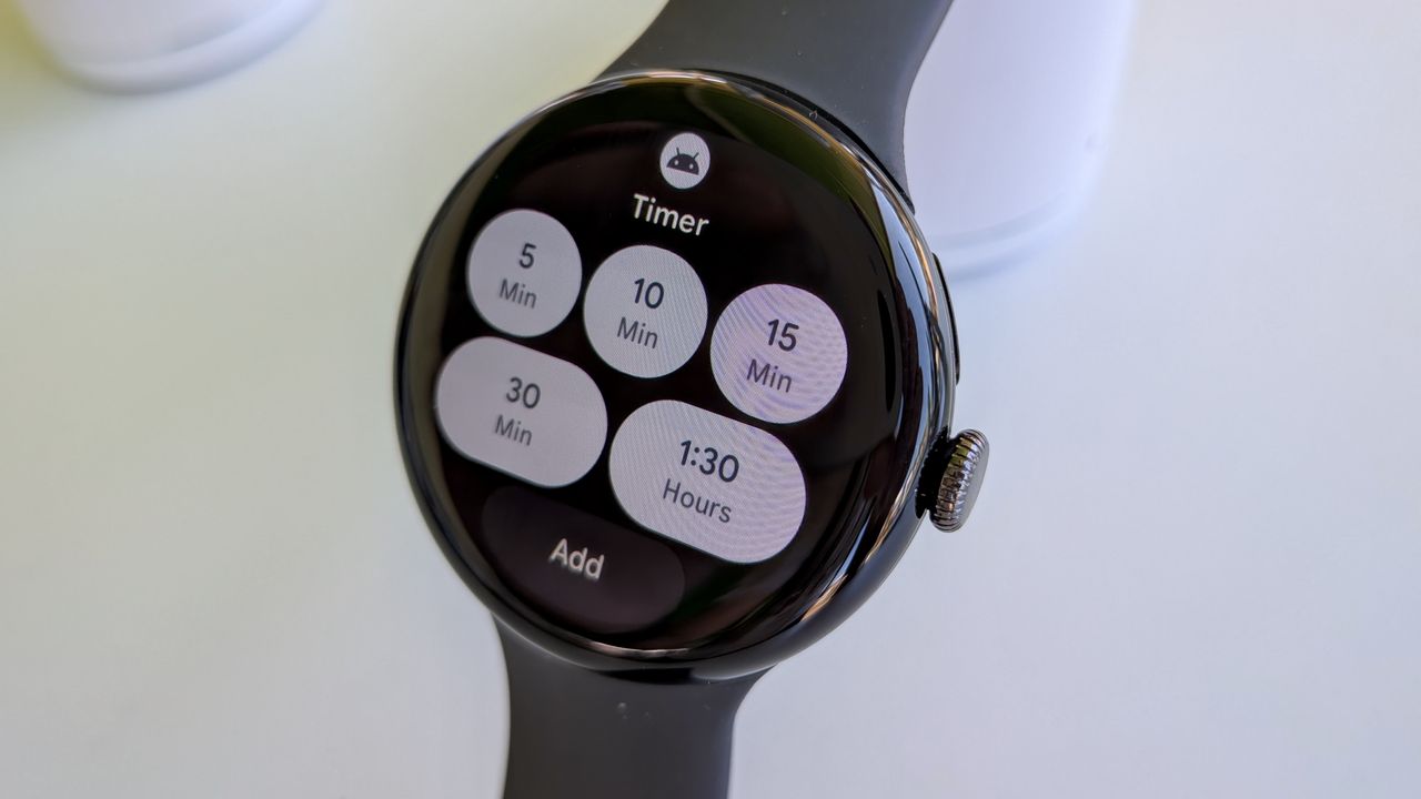The new Timer tile on Wear OS 6 on the Pixel Watch 3, showing default buttons for 5, 10, 15, and 30 minute and 1:30 hour timers, plus an Add button