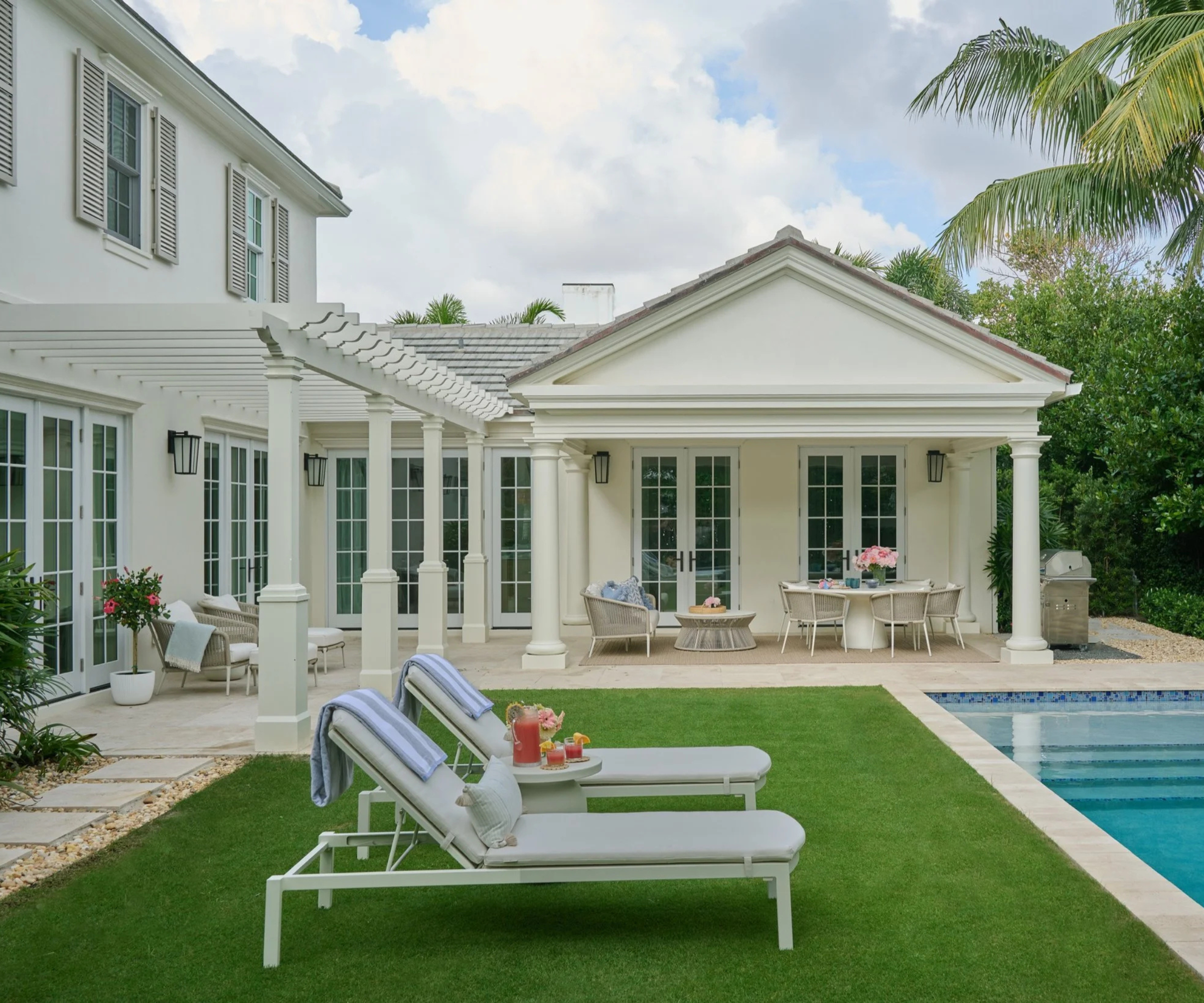 outdoor pool deck with lounge chairs