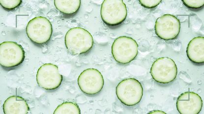 Slices of cucumber in ice to use in the frozen cucumber on face skincare trick