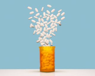 Pills exploding out of bottle