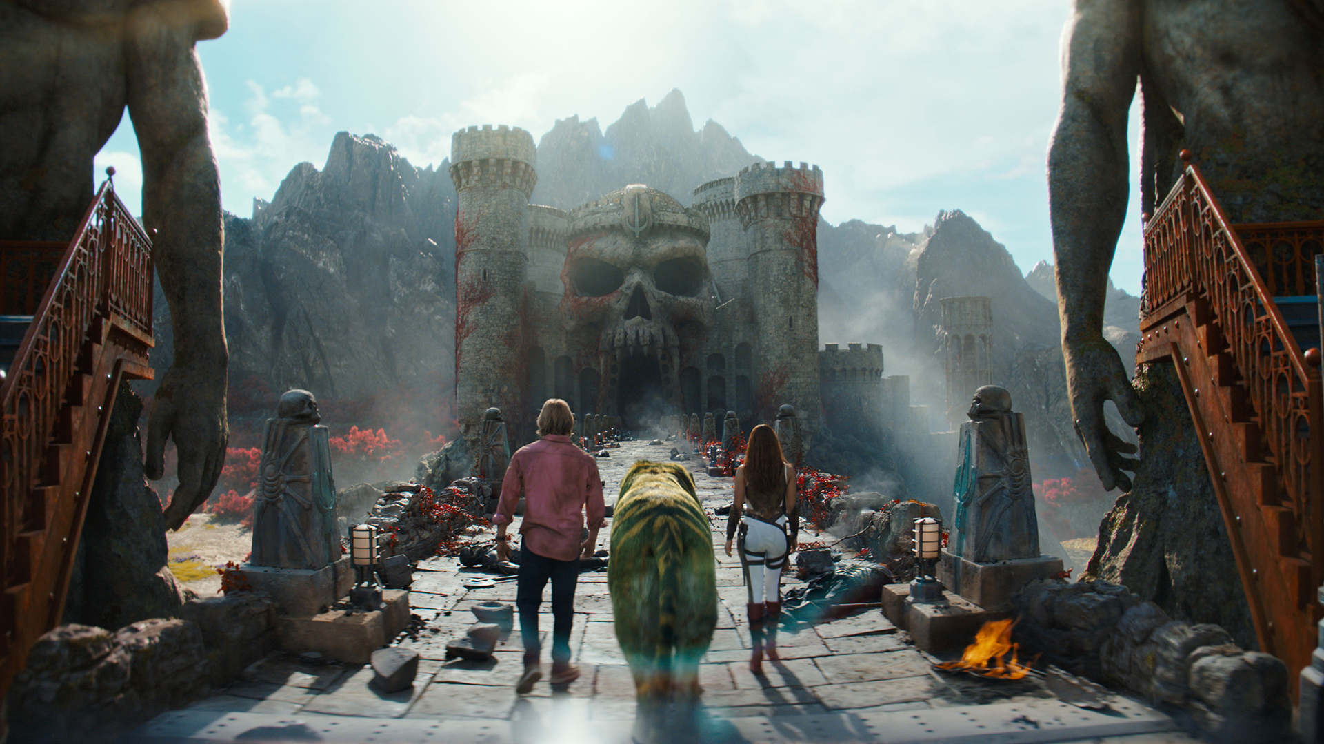 Adam, Cringer, and Teela walking towards Castle Grayskull in Amazon's Masters of the Universe movie