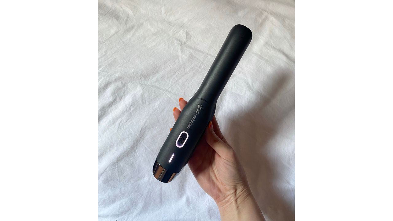 Original image showing handheld view of ghd Unplugged Straightener