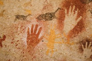 Paleolithic handprint paintings in Argentina.