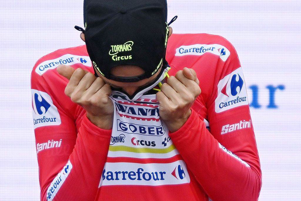 ESPINOSA DE LOS MONTEROS SPAIN AUGUST 16 Detailed view of Rein Taarame of Estonia and Team Intermarch Wanty Gobert Matriaux celebrates winning and kisses his the red leader jersey on the podium ceremony after the 76th Tour of Spain 2021 Stage 3 a 2028km stage from Santo Domingo de Silos to Espinosa de los Monteros Picn Blanco 1485m lavuelta LaVuelta21 CapitalMundialdelCiclismo on August 16 2021 in Espinosa de los Monteros Spain Photo by Stuart FranklinGetty Images