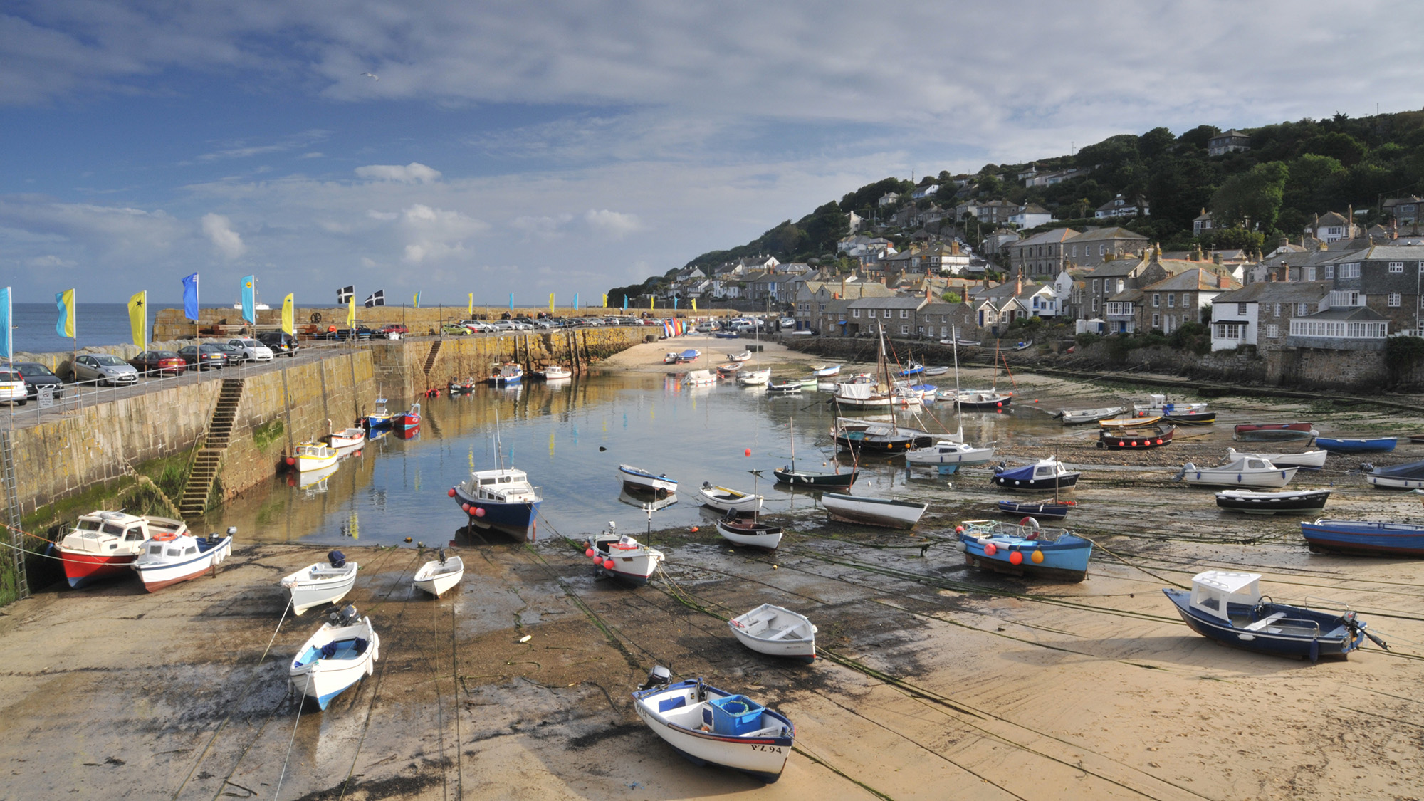 Boats in harbour, tide out, sand