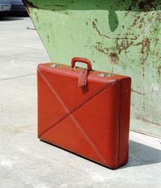 Calf leather suitcase lined with red silk moiré, 1947