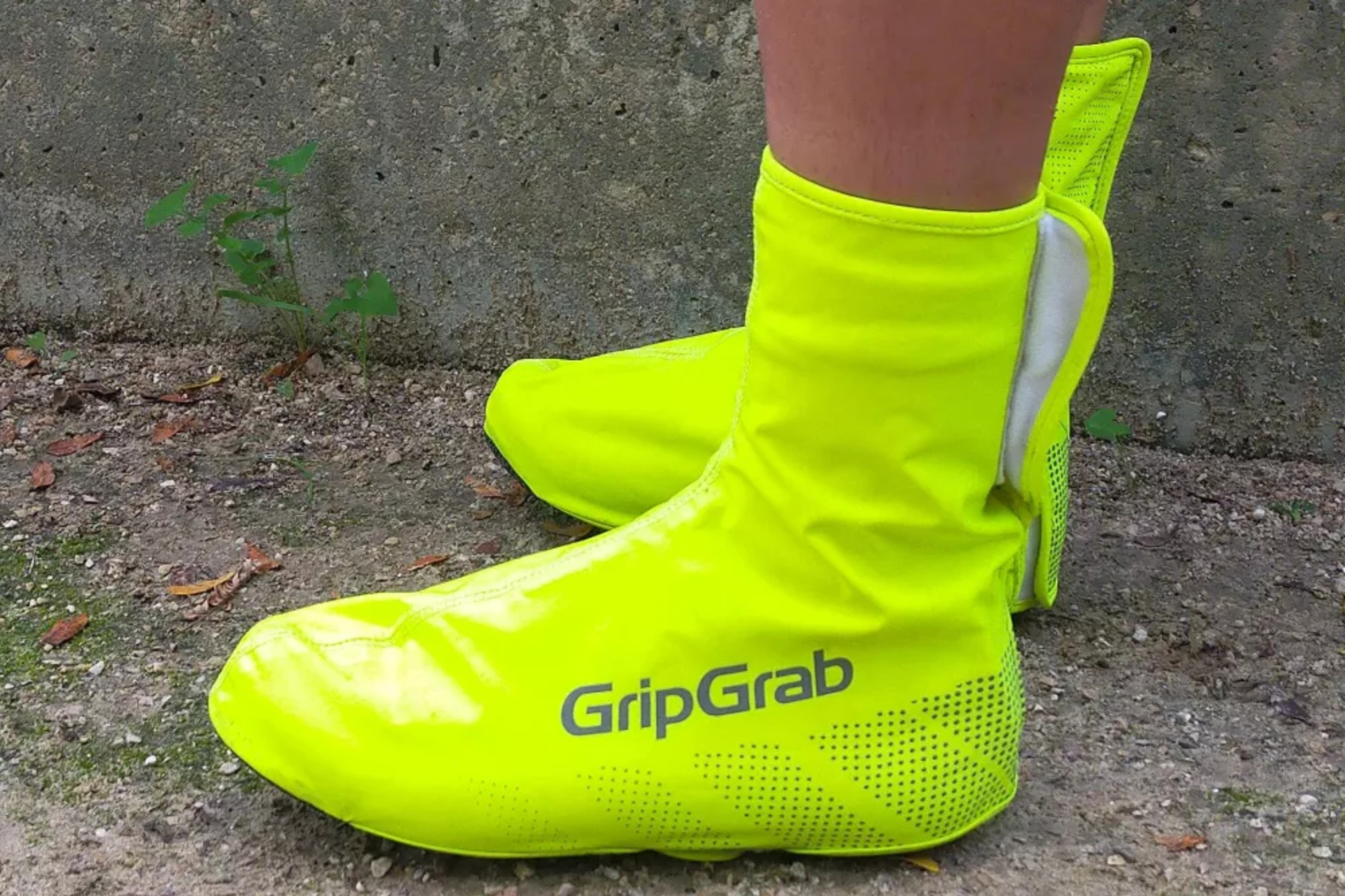 Image shows a rider wearing the GripGrab Ride Waterproof shoe covers.