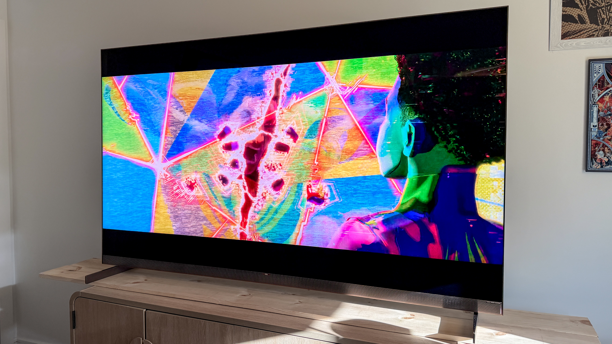 TCL X11L SQD Mini-LED TV on a side table