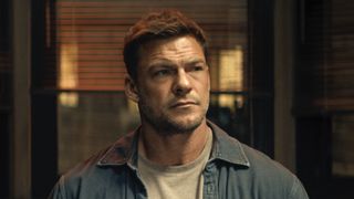 Reacher sitting at table being interrogated in Reacher Season 4