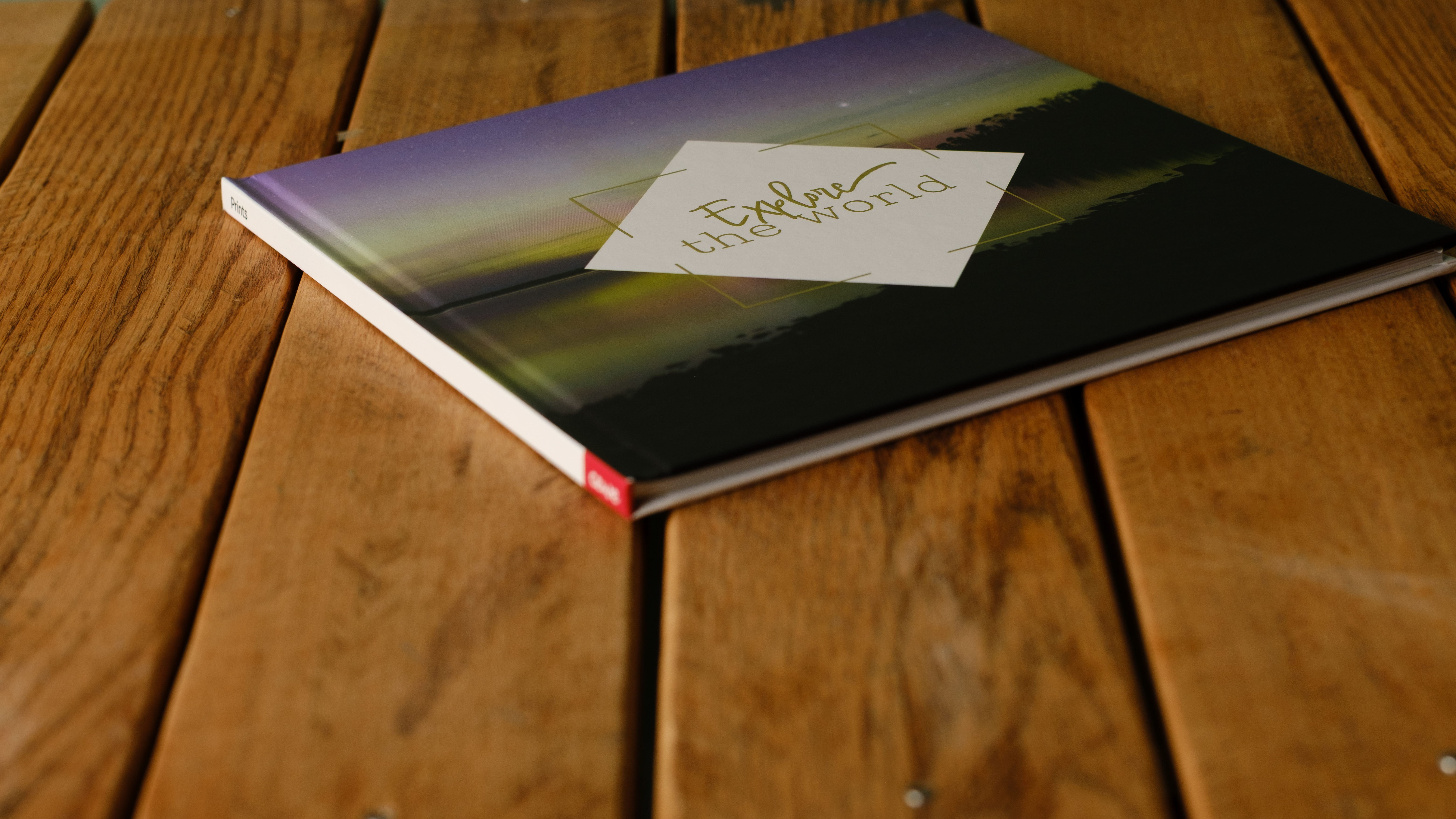 A photobook from CEWE on a desk