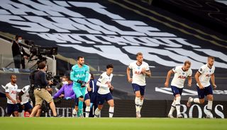 Hugo Lloris, centre left, and Son Heung-min, centre right, come out at the start of the second half