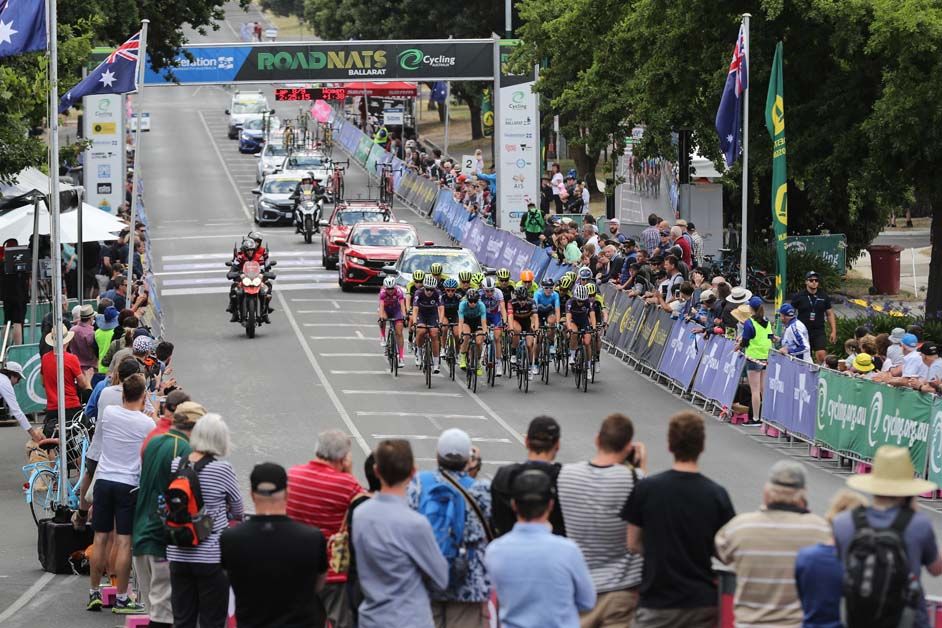 The peloton heads through the start/finish area