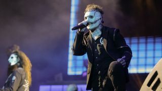 Corey Taylor singing on stage