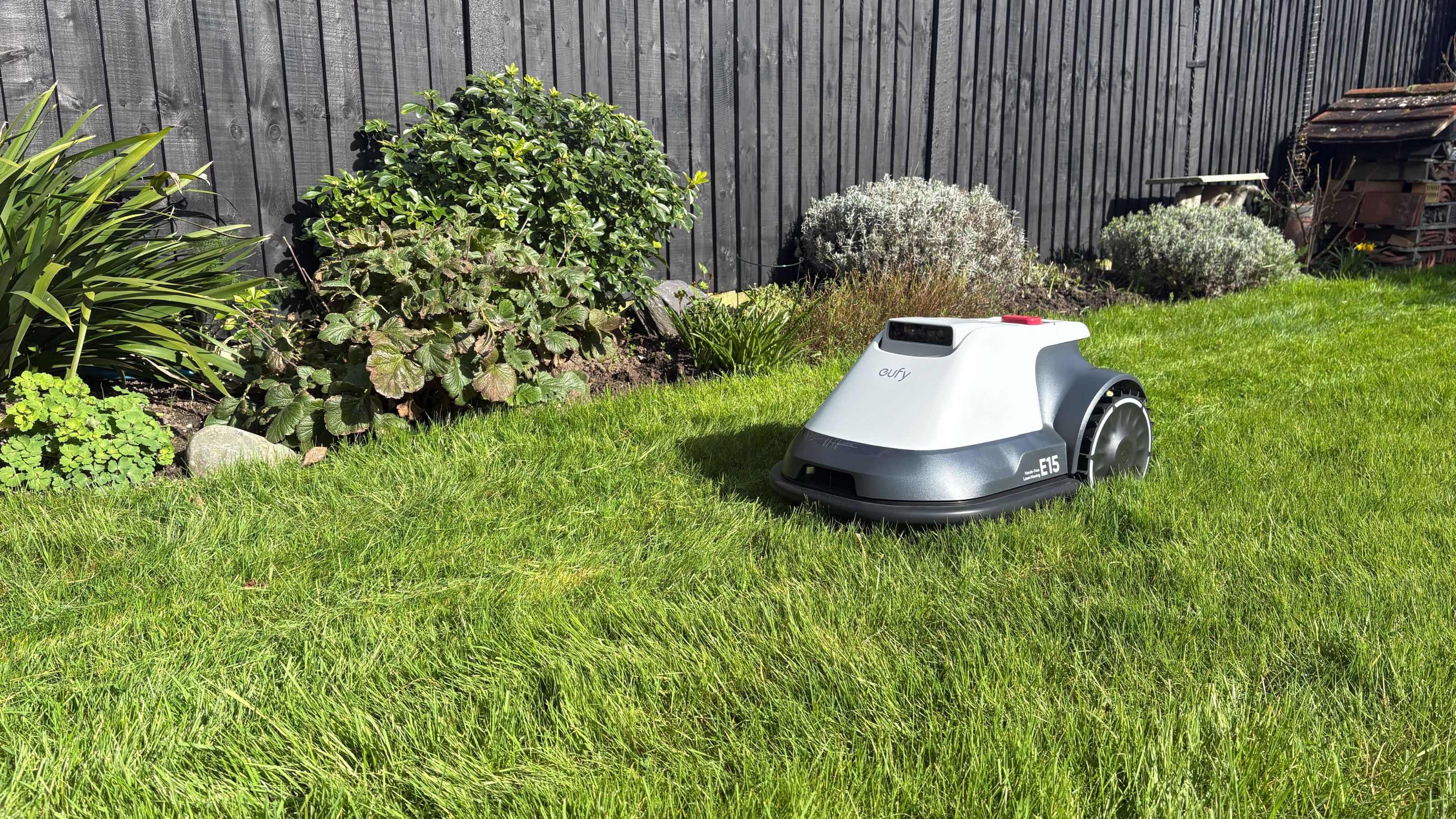 Eufy E15 Robot Lawn Mower mowing grass in garden