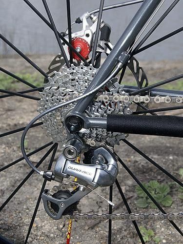 The road shifters naturally require the use of the corresponding road rear derailleur.