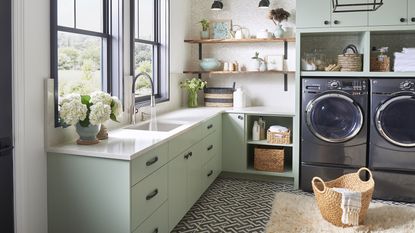 blanco laundry room sink, washing machine, tumble dryer, wood shelving, rattan baskets