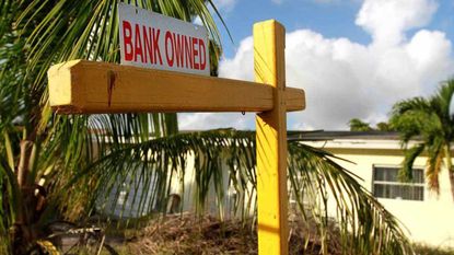 A "bank owned" sign outside of a Florida home