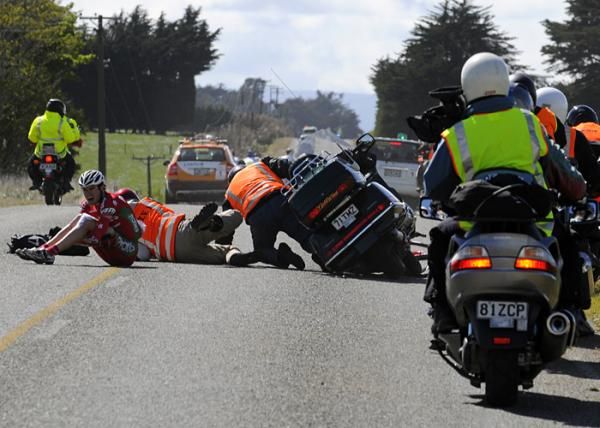 Media vehicle crashes after running over fallen riders bicycle