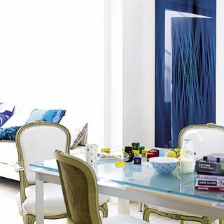 dinning room with long blue curtains dinning table and chair