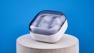 the samsung galaxy buds 4 pro in white photographed against the blue tom's guide background