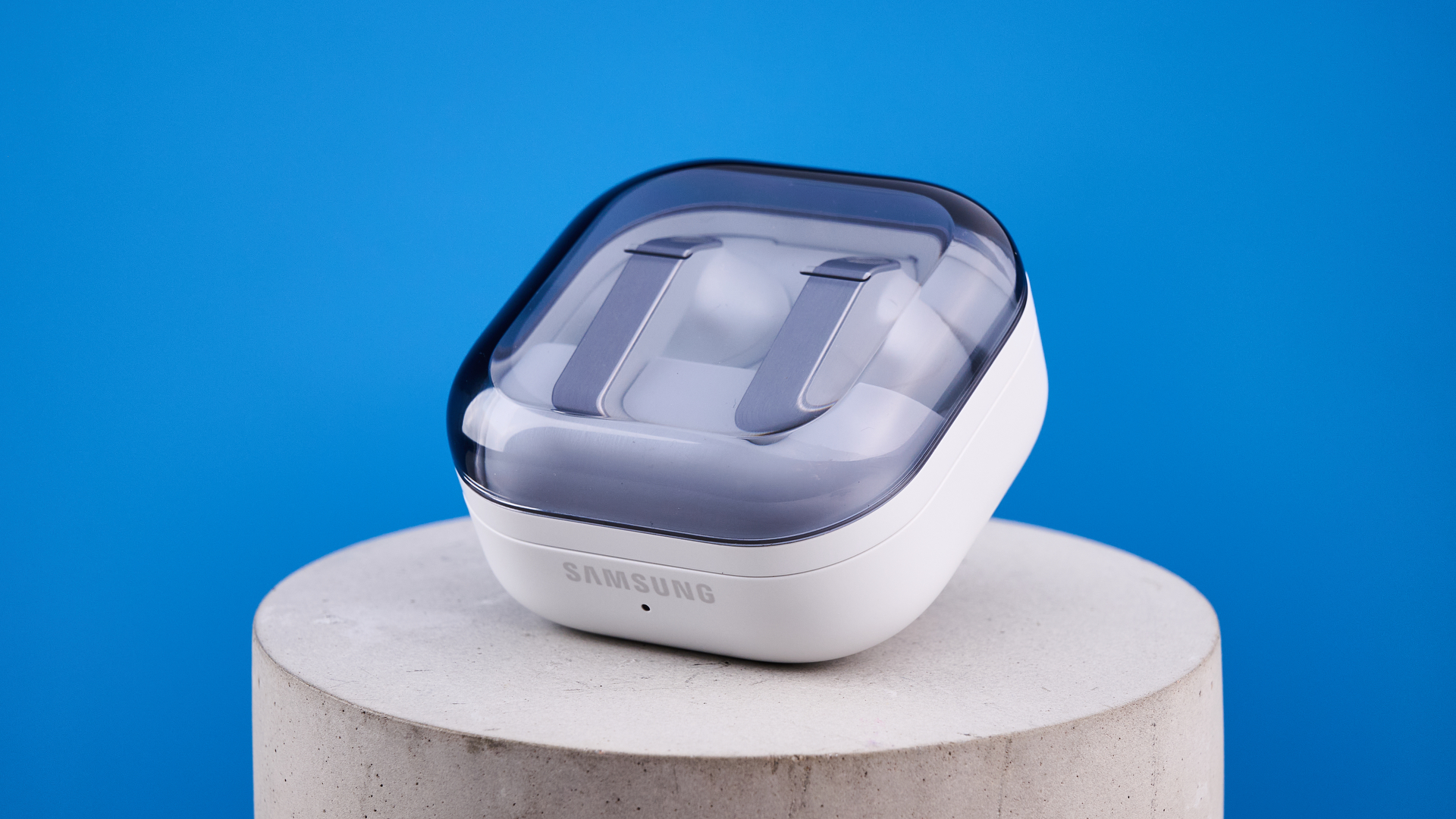 the samsung galaxy buds 4 pro in white photographed against the blue tom's guide background