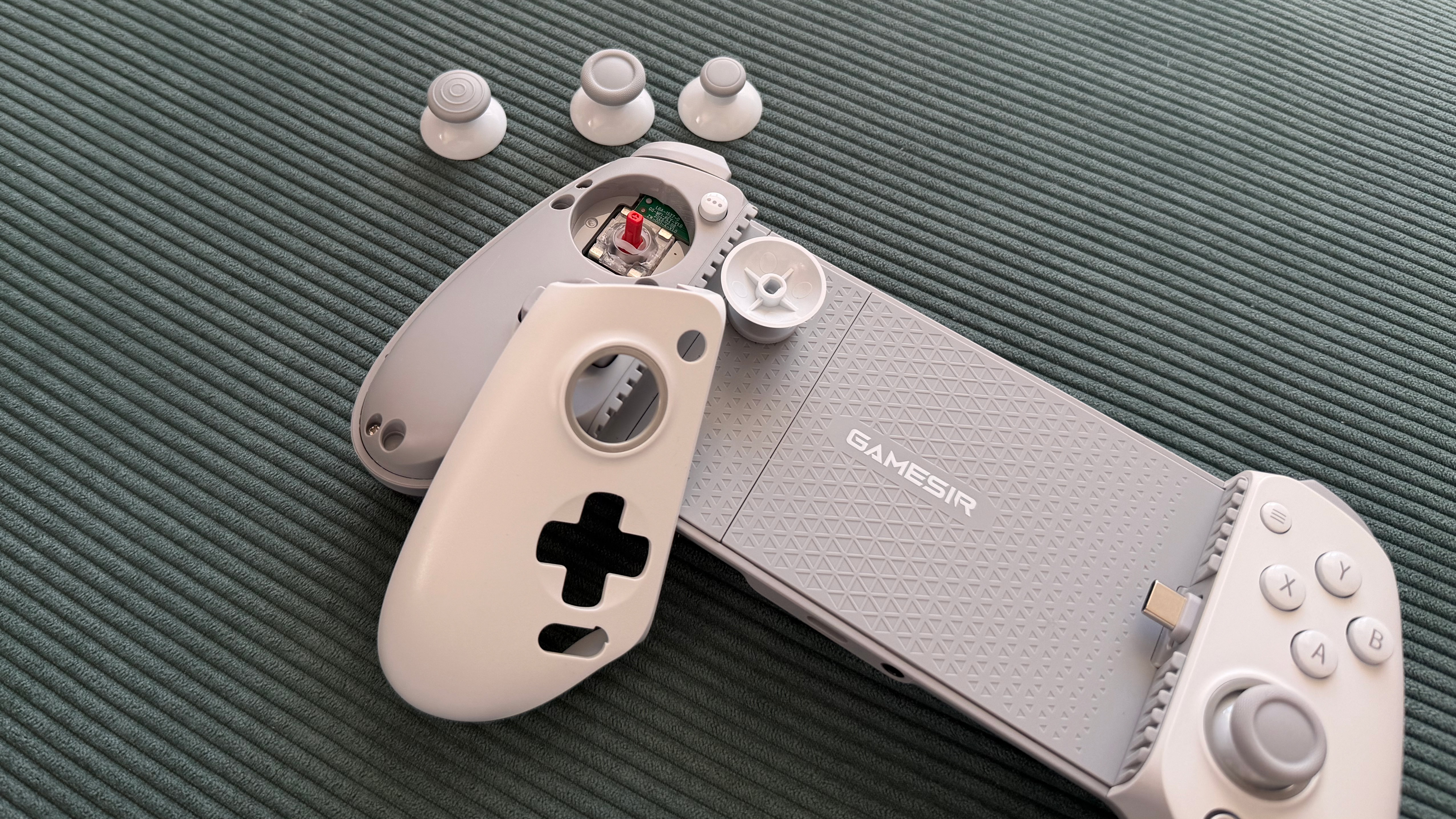 The GameSir G8+ MFi mobile controller on a green surface