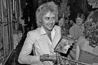 Roger Taylor with a 1953 issue of the comic Astounding Science Fiction