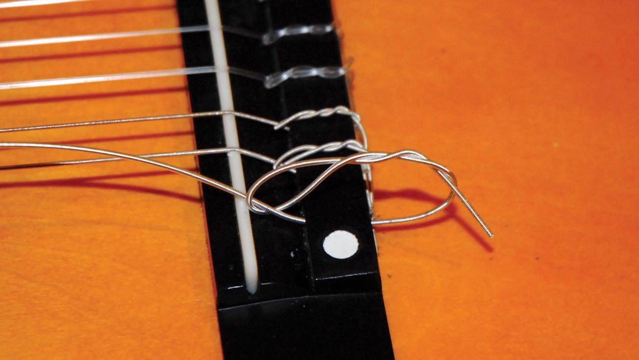 Guitar setup how to restring a nylonstring classical guitar MusicRadar