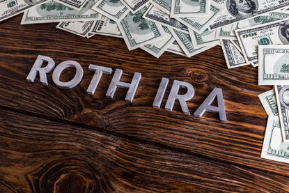 Concept art showing the phrase Roth IRA spelled out next to some money.