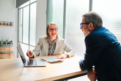 A financial adviser meets with a client.