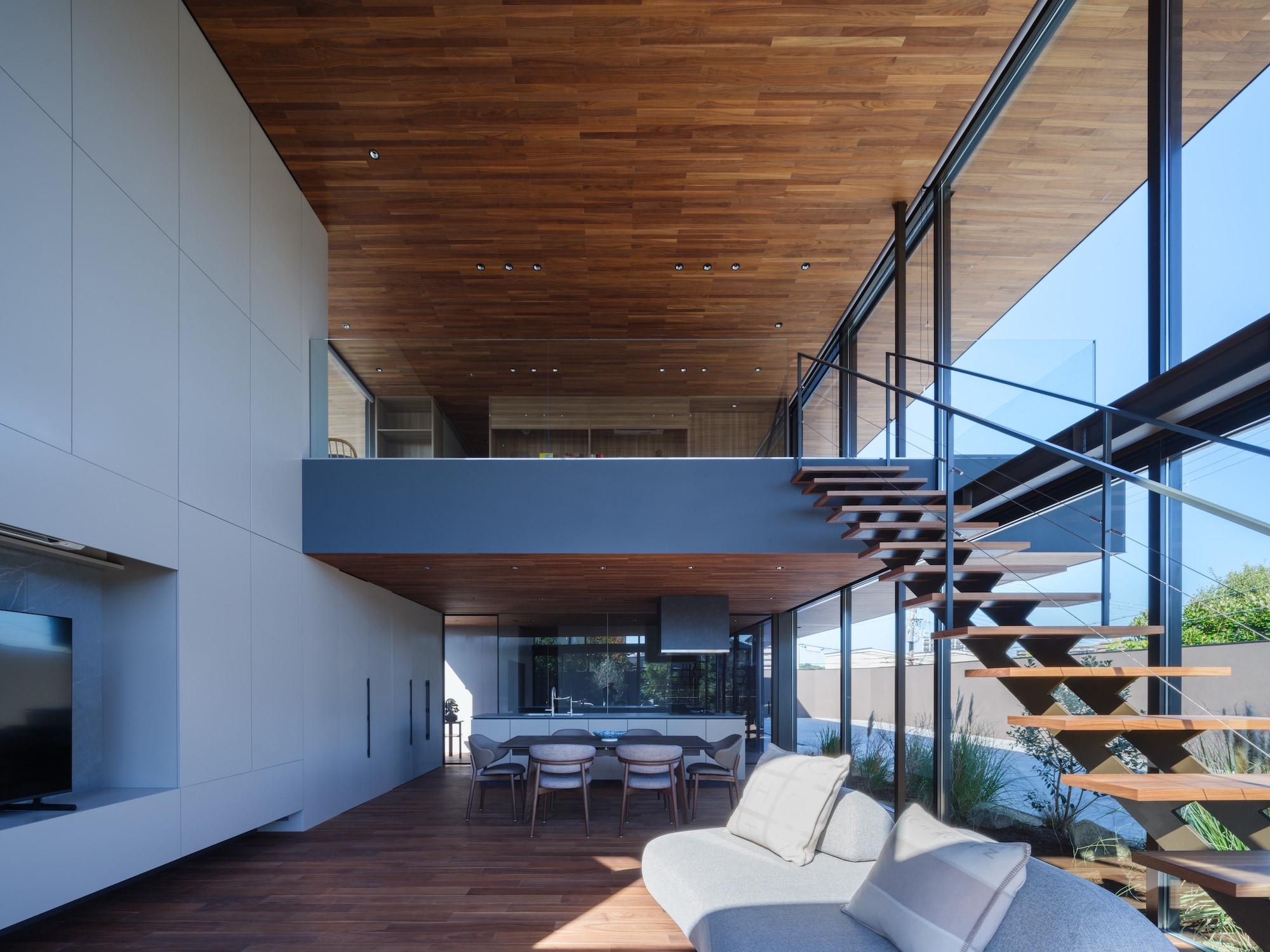 an Osaka house by apollo architects &amp;amp; associates featuring a dramatic roof and double height interiors