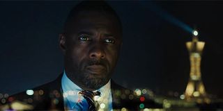 Idris Elba looking out over the city in The Take