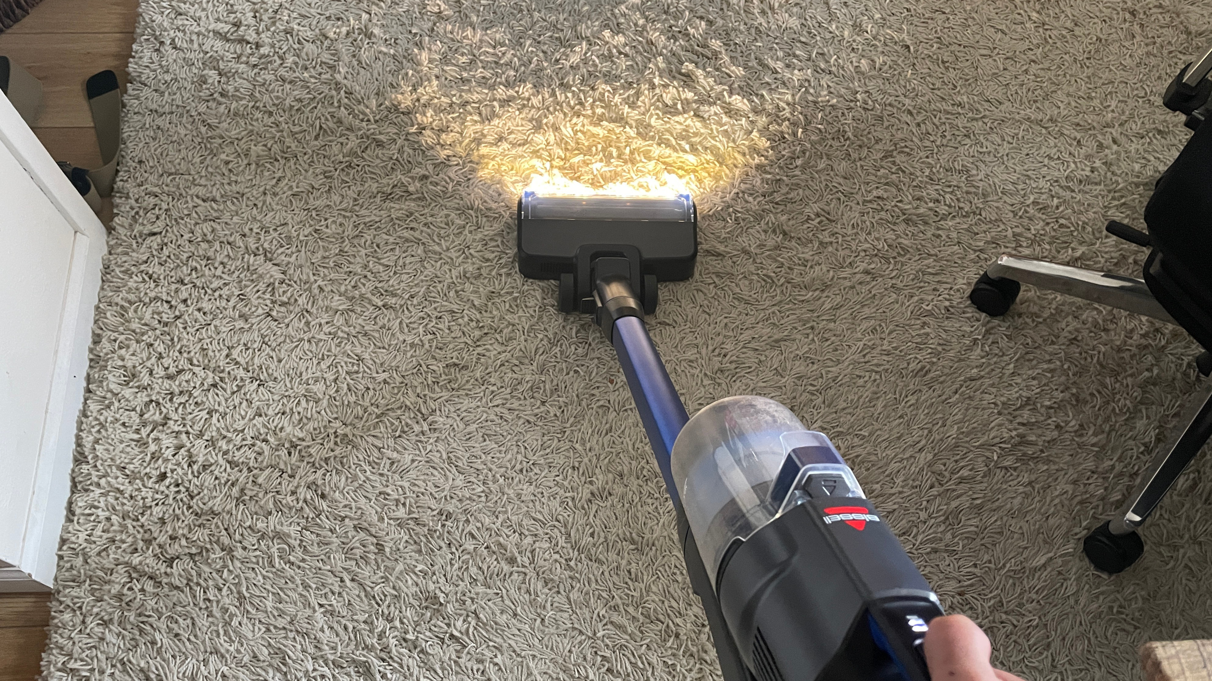 Bissell PowerClean FurFinder Cordless Stick Vacuum on beige carpet