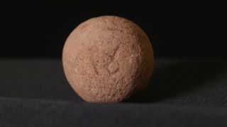A standardized weight marked with an ancient Egyptian abbreviation for a sheqel was found in the remains of the house. It was used for weighing expensive trade goods, like spices.