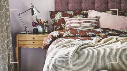 Purple bedroom with a button-back headboard and brown floral bedding with a knitted throw to show how to make a bedroom cosy with layers