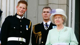 Prince Harry wearing his Sandhurst army uniform, Prince Andrew the Duke of York and HM Queen Elizabeth ll watch the flypast over The Mall of British and US World War II aircraft from the Buckingham Palace balcony on National Commemoration Day July 10, 2005 in London. Poppies were dropped from the Lancaster Bomber of the Battle Of Britain Memorial Flight as part of the flypast.