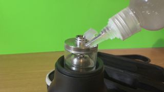 A bottle refilling the Telesin C40 Portable Smoke Machine