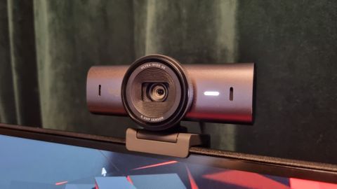 The Logitech MX Brio 4K webcam mounted to the top of a monitor