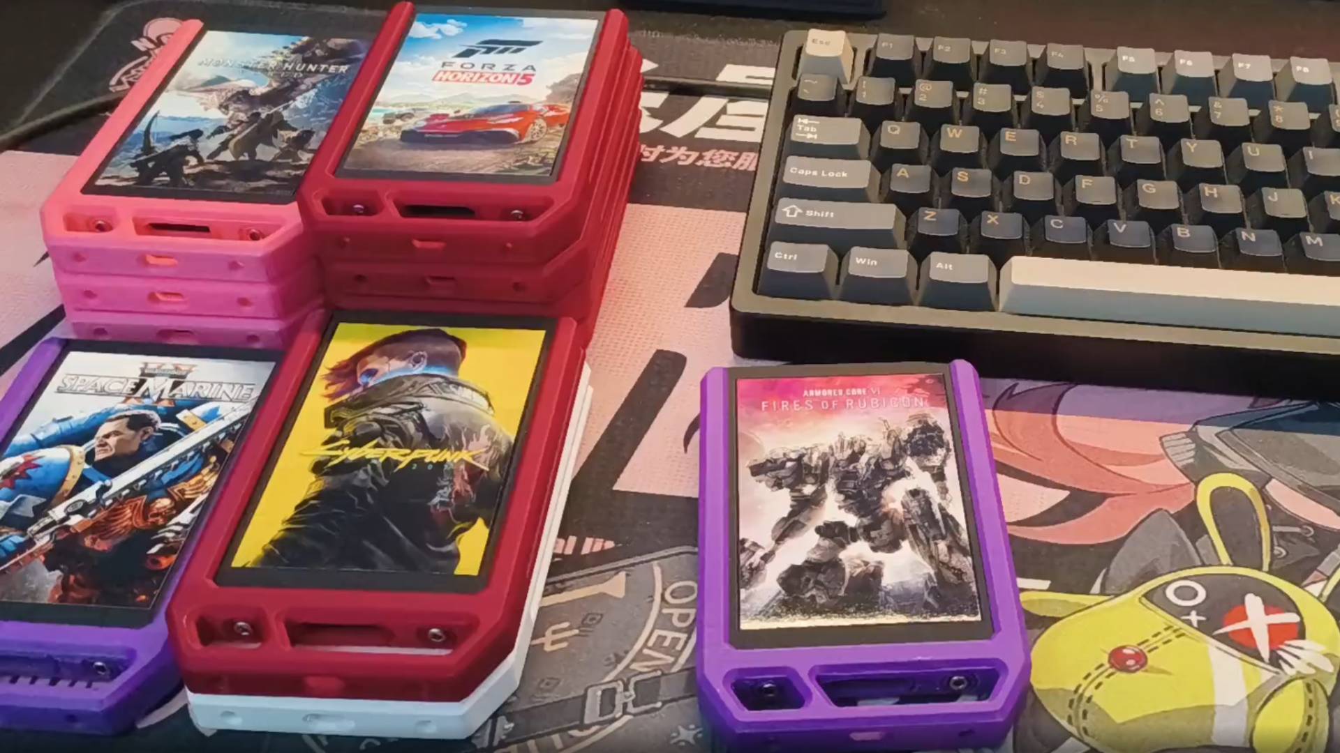 A selection of SSD-based 'game catridges' with colourful housing and cover art, on a desk.