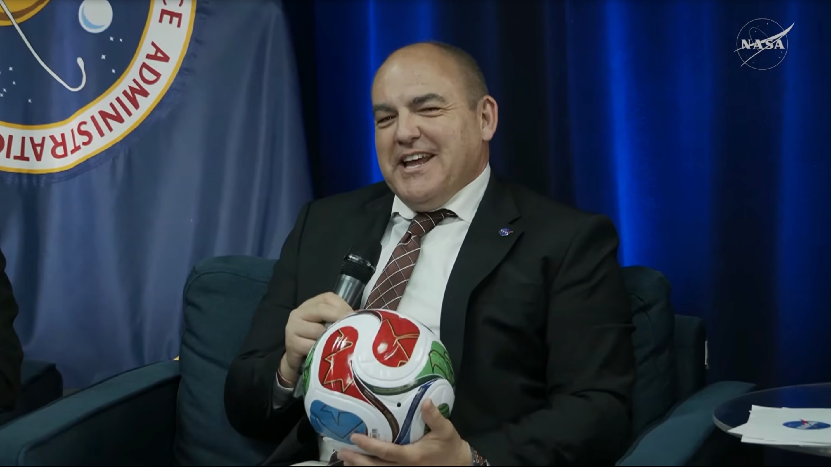 Carlos Garcia-Galan, manager of NASA's Moon Base program, holds a FIFA World Cup 2026 soccer ball during a press event on June 30, 2026.