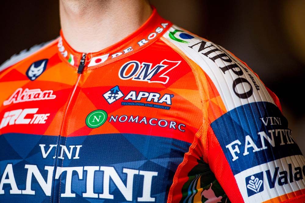 There are lots of small sponsors on the chest of the jersey